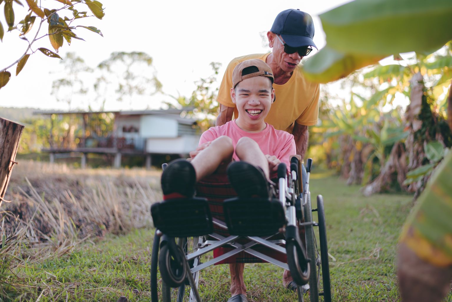 Young man with disability and father